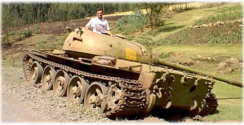 Andrew loves to play with a large gun.