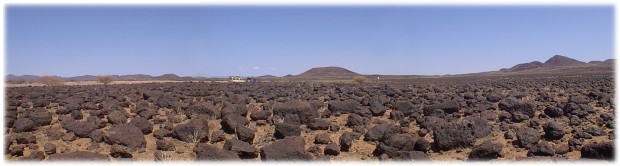 Driving through volcanic boulder field