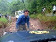 Andrew puts on his best togs to winch the truck out of the mud